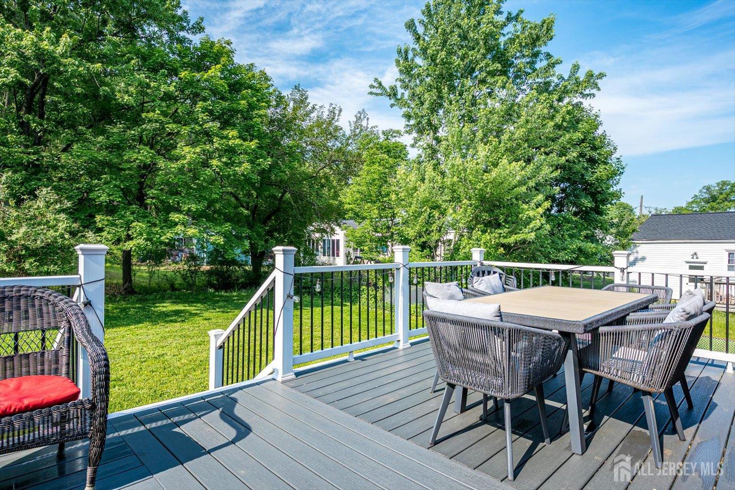 12 Gales Road Edison, NJ 08837 - Photo 29 of 35 a view of a chairs and table on the wooden deck