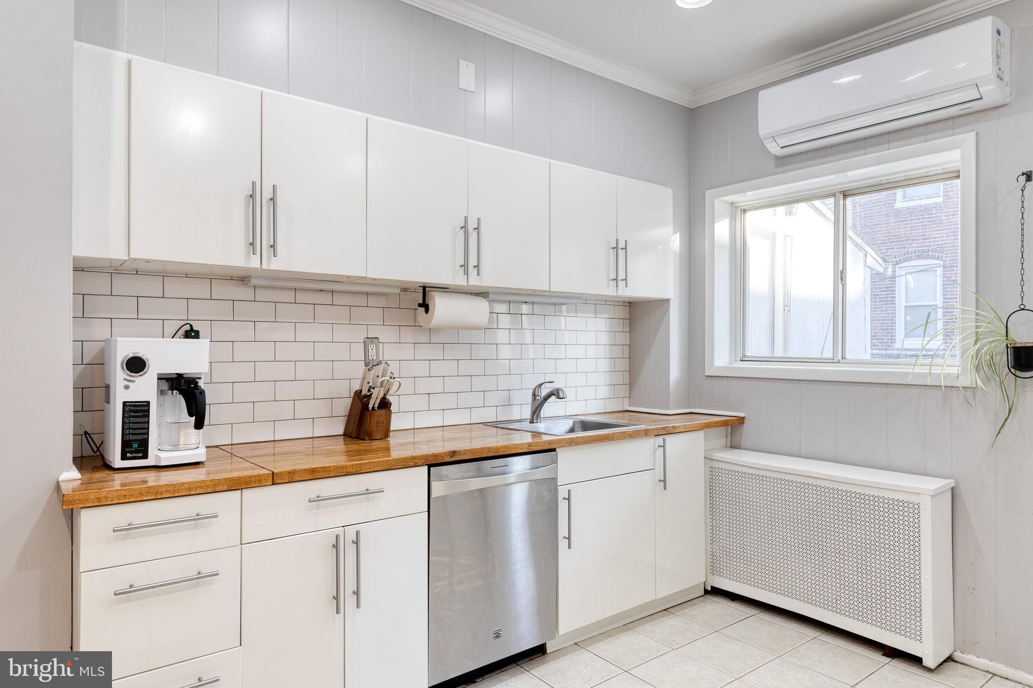 3903 Hudson Street Baltimore, MD 21224 - Photo 14 of 34 a kitchen with white cabinets and white appliances