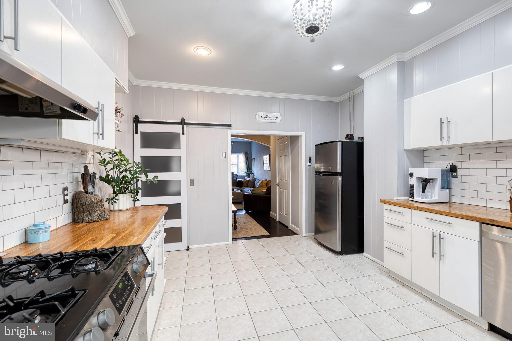 3903 Hudson Street Baltimore, MD 21224 - Photo 15 of 34 a kitchen with refrigerator and cabinets