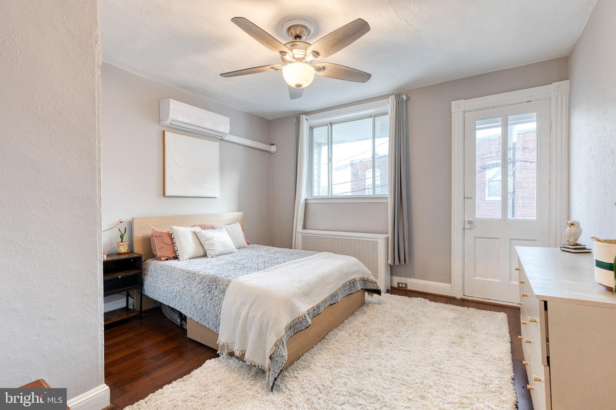 3903 Hudson Street Baltimore, MD 21224 - Photo 19 of 34 a bedroom with a bed and a chandelier