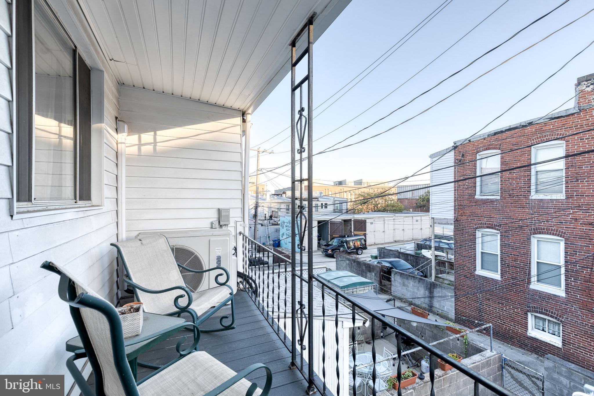 3903 Hudson Street Baltimore, MD 21224 - Photo 22 of 34 a view of a balcony with chairs