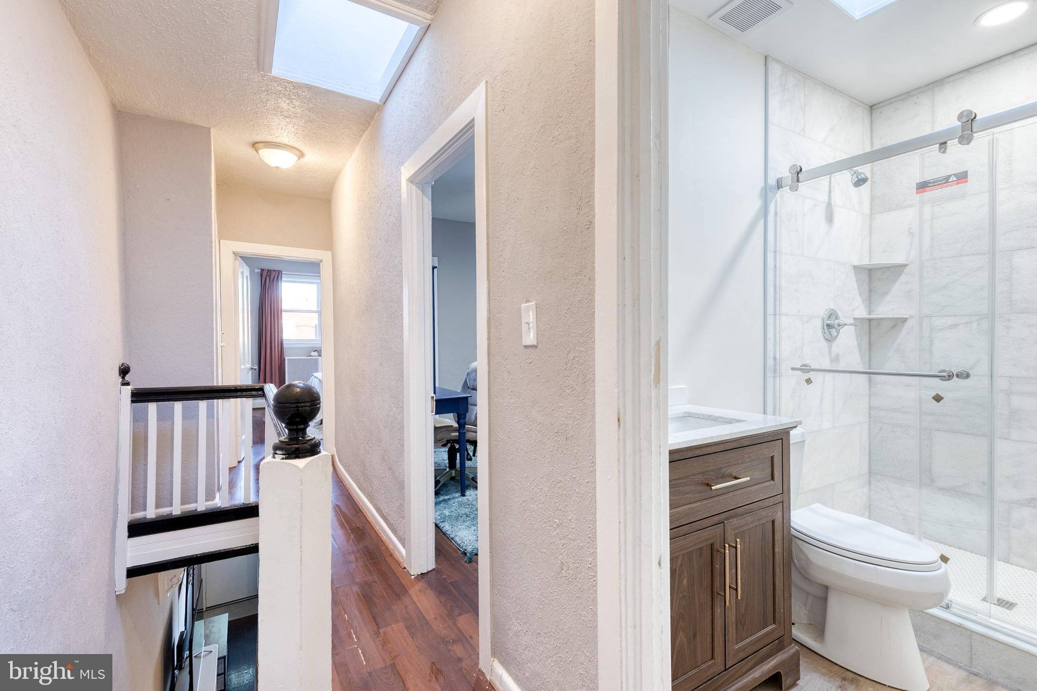 3903 Hudson Street Baltimore, MD 21224 - Photo 27 of 34 a bathroom with a sink toilet and shower