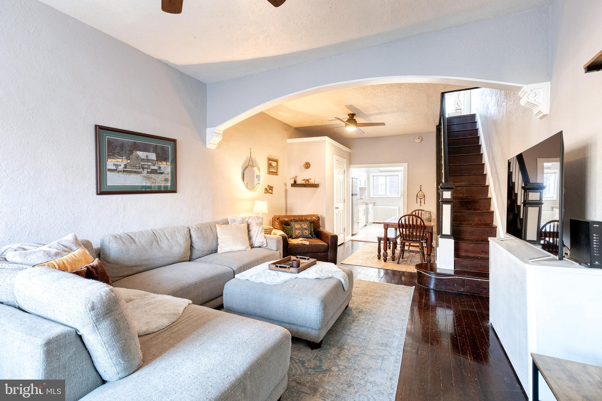 3903 Hudson Street Baltimore, MD 21224 - Photo 3 of 34 a living room with furniture and a flat screen tv