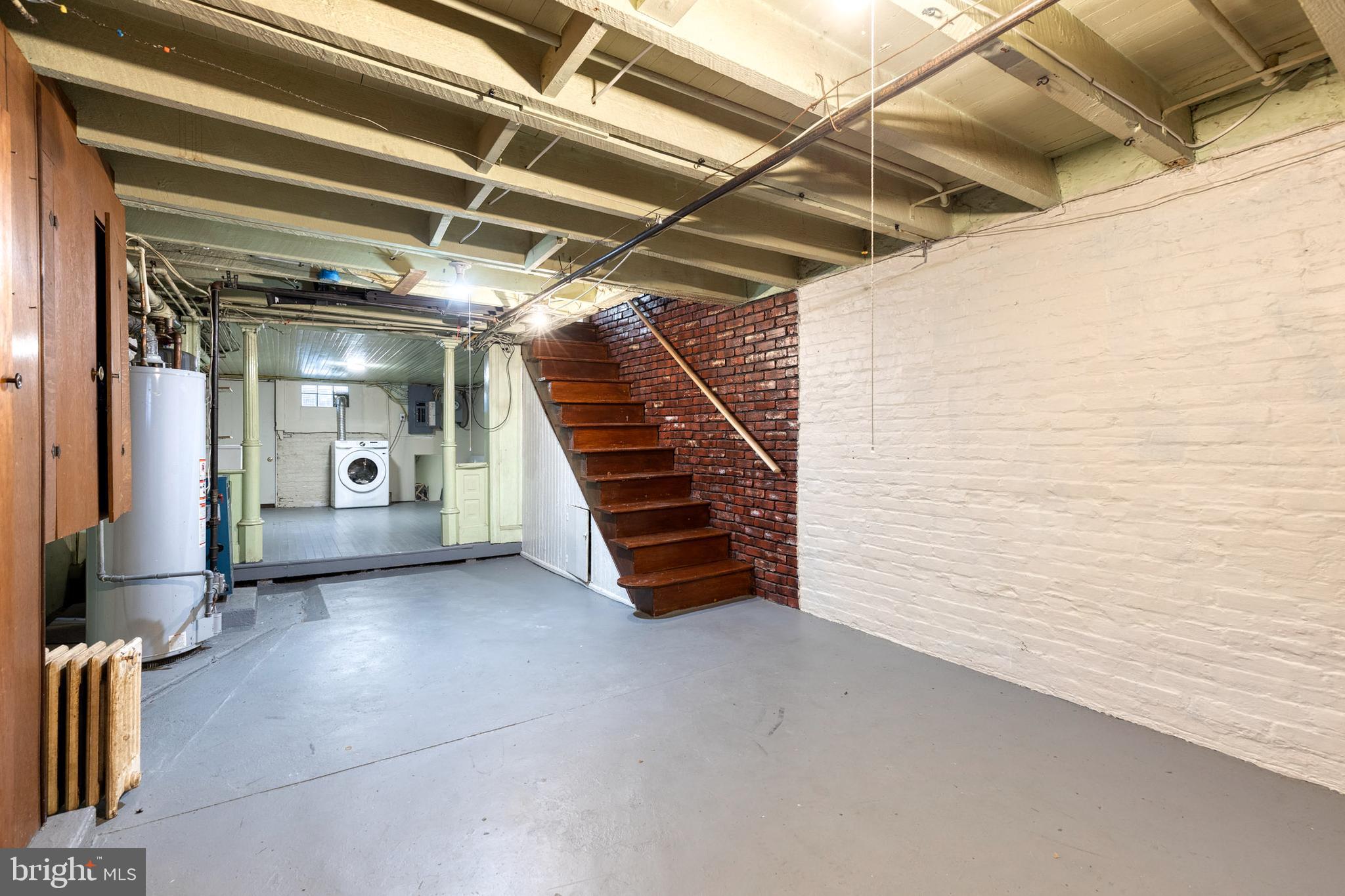 3903 Hudson Street Baltimore, MD 21224 - Photo 32 of 34 a view of a hallway with stairs and a couch