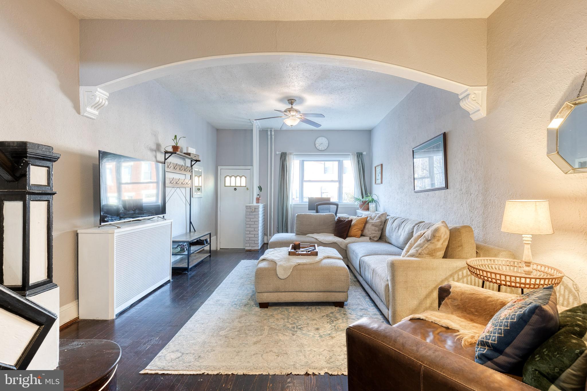 3903 Hudson Street Baltimore, MD 21224 - Photo 5 of 34 a living room with furniture and a chandelier