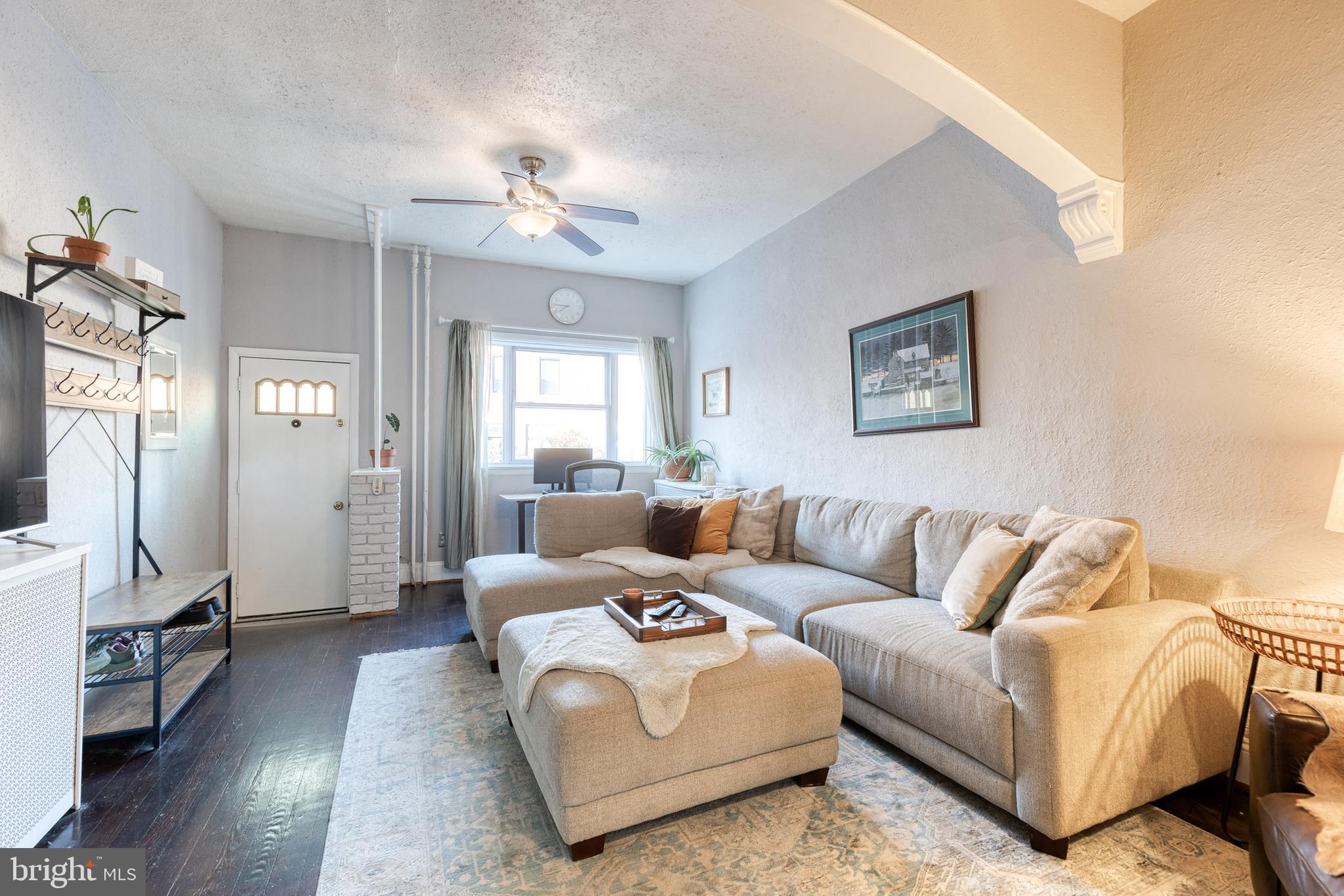 3903 Hudson Street Baltimore, MD 21224 - Photo 6 of 34 a living room with furniture and a flat screen tv