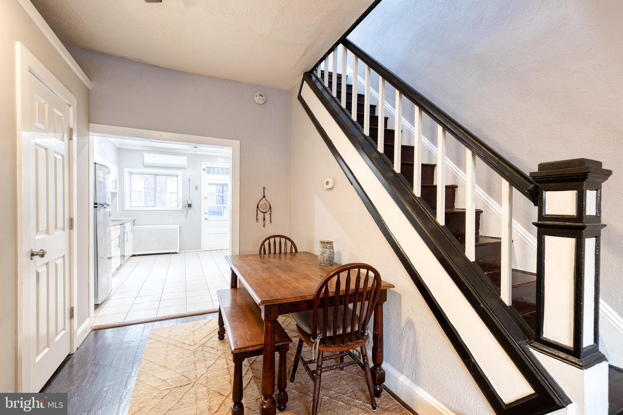 3903 Hudson Street Baltimore, MD 21224 - Photo 7 of 34 a view of an entryway with wooden floor and stairs