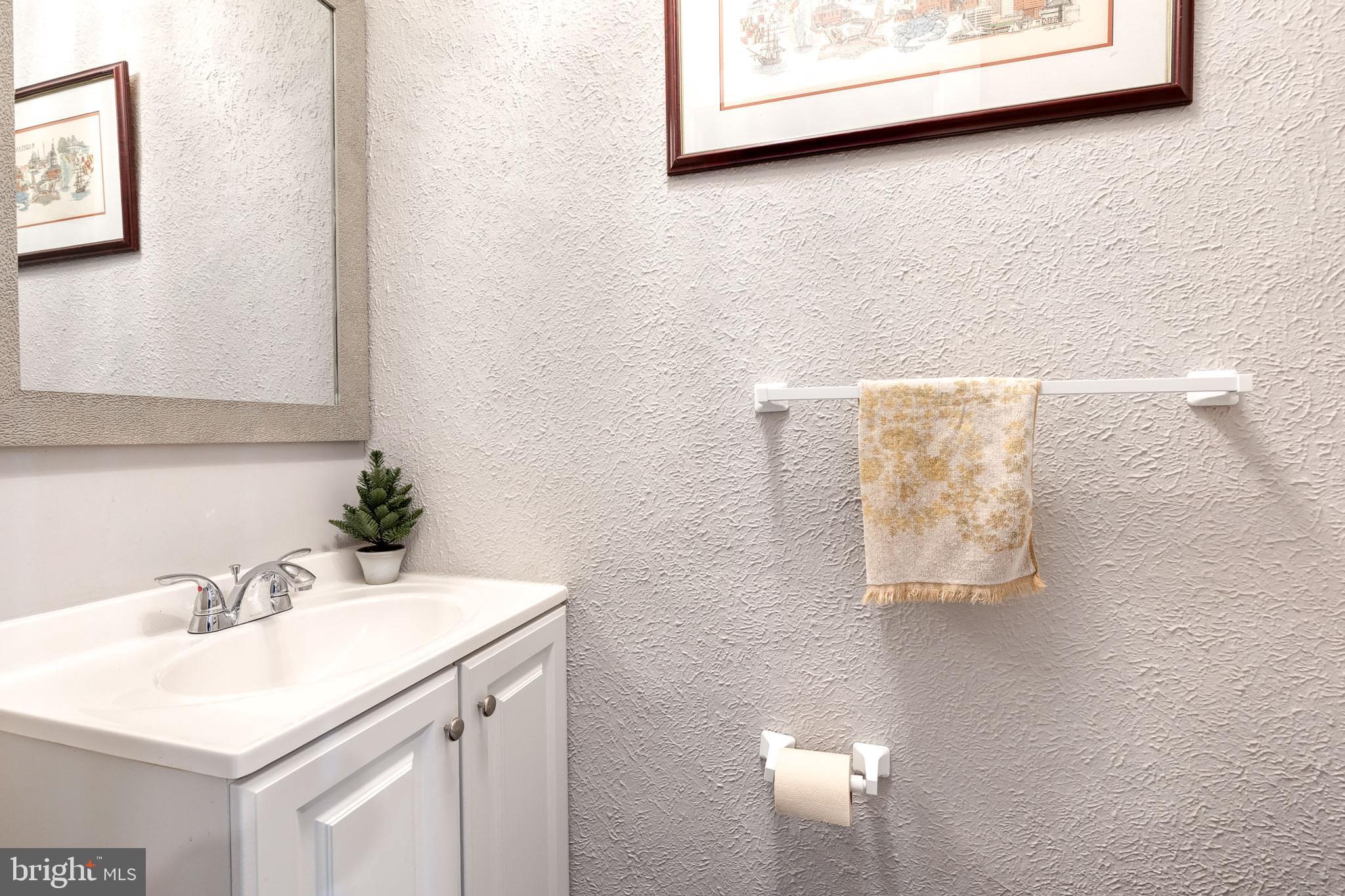 3903 Hudson Street Baltimore, MD 21224 - Photo 10 of 34 a bathroom with a sink and a mirror