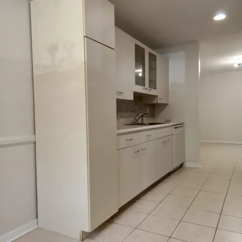 a kitchen with a sink and cabinets