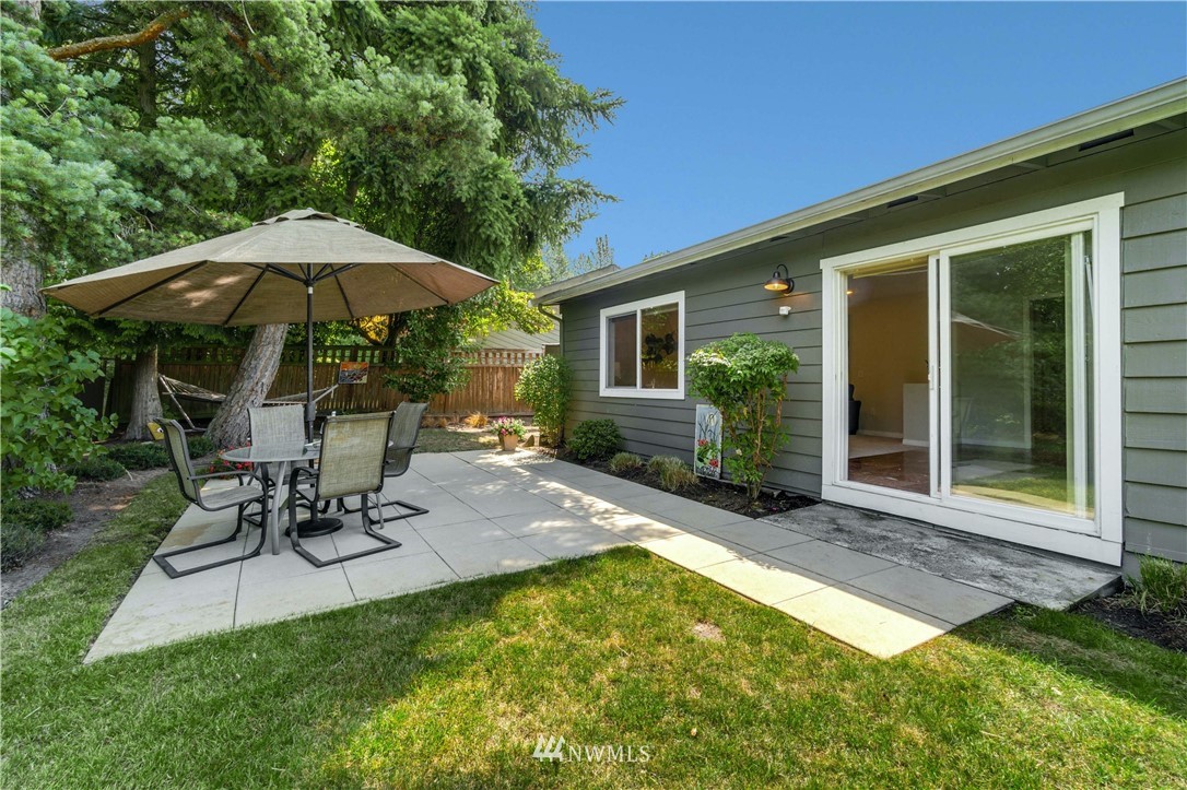 750 South 25th Street Renton, WA 98055 - Photo 22 of 37 a view of a backyard with table and chairs under an umbrella