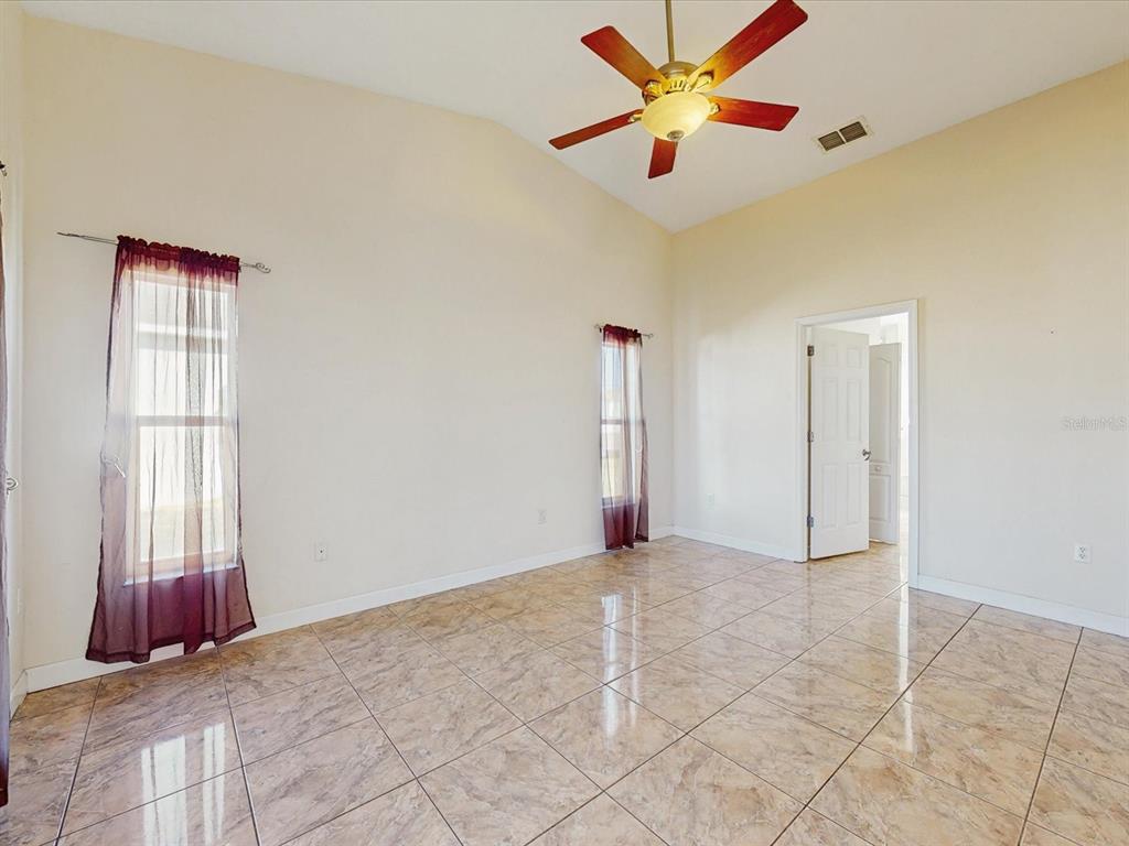 978 Alsace Drive Kissimmee, FL 34759 - Photo 6 of 30 a view of an empty room with a window