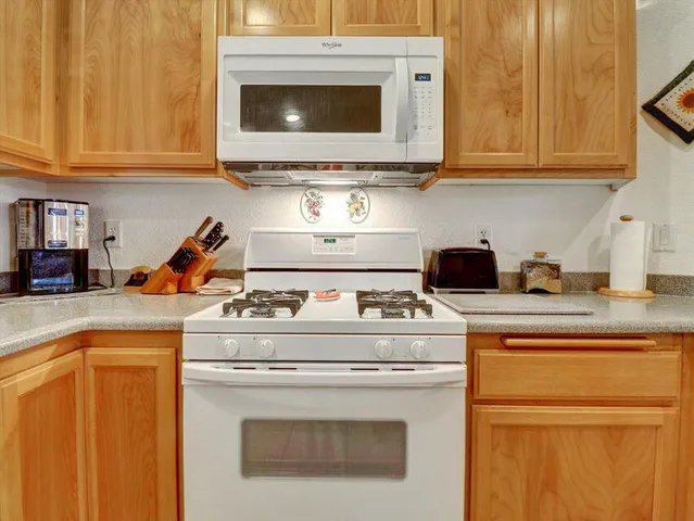 an aerial view of residential house with outdoor space and parking