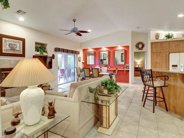 a kitchen with a refrigerator and cabinets