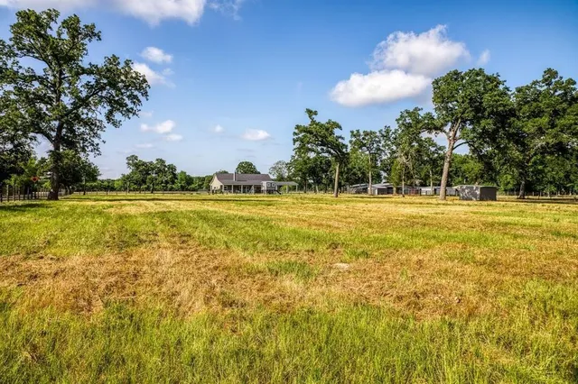 a view of a swimming pool with an outdoor space and seating area