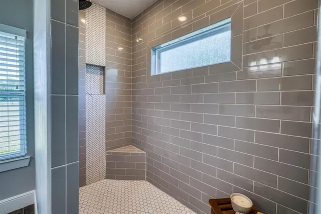 a bathroom with a sink and shower