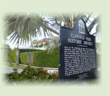 a view of a street with potted plants