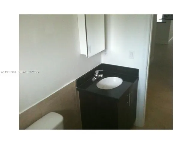a bathroom with a sink and mirror