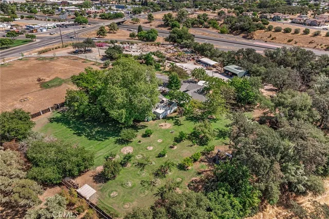an aerial view of a house with a yard