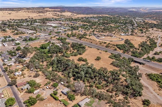 an aerial view of residential houses with city view