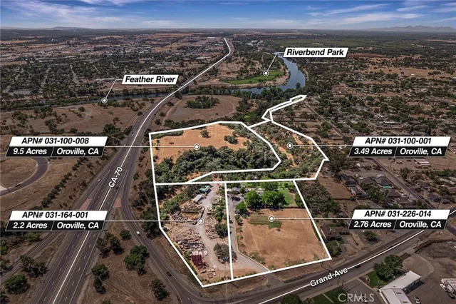 an aerial view of residential houses with city view