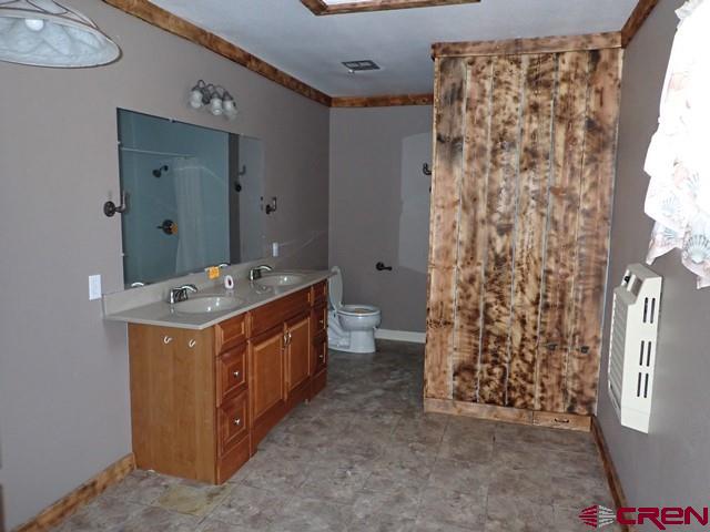 10944 Mesa View Loop Eckert, CO 81418 - Photo 6 of 10 a room with a stove top oven a sink and a refrigerator