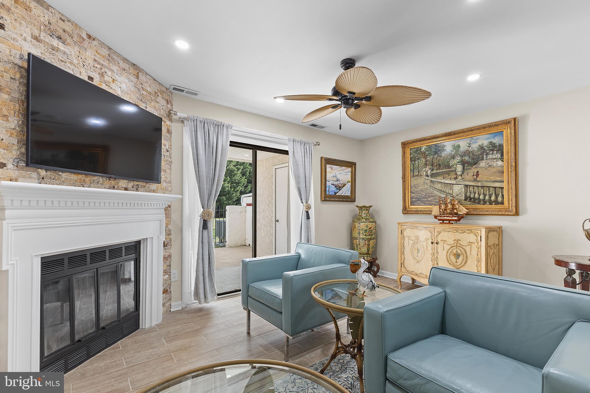 8 Queen Victoria Way Chester, MD 21619 - Photo 17 of 46 Living area w/wood-burning fireplace