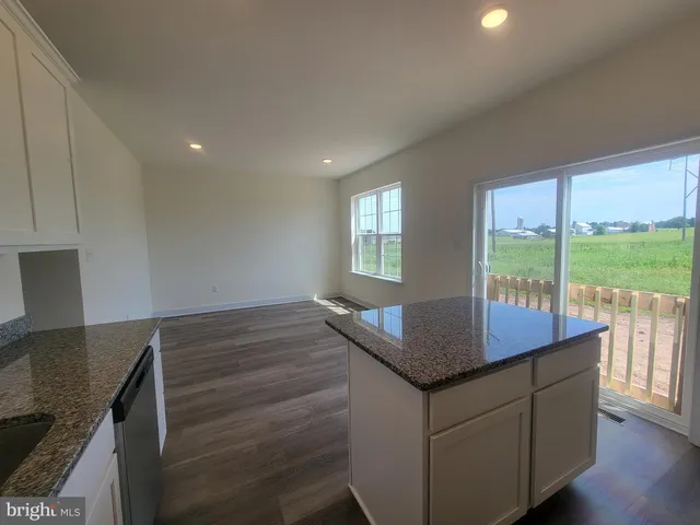 a kitchen with sink and cabinets