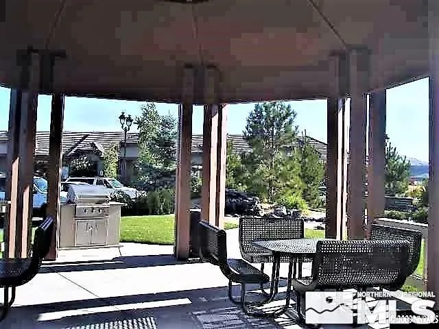 a patio view with a table and chairs
