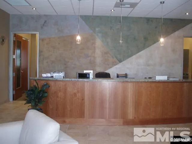 a view of a bathroom with a sink and a mirror