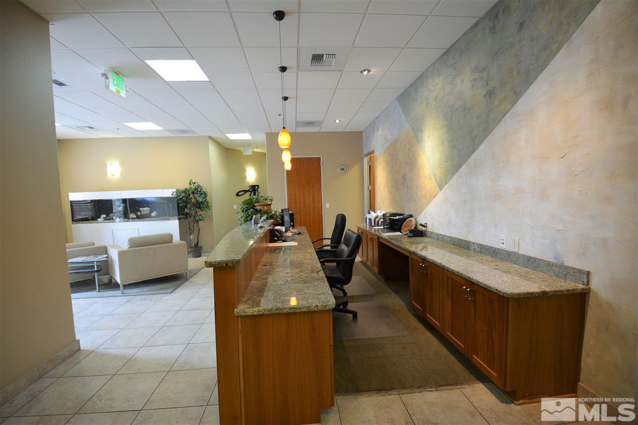 140 West Huffaker Lane, Unit 505 505 Reno, NV 89511 - Photo 9 of 23 a bathroom with a sink a vanity and mirror