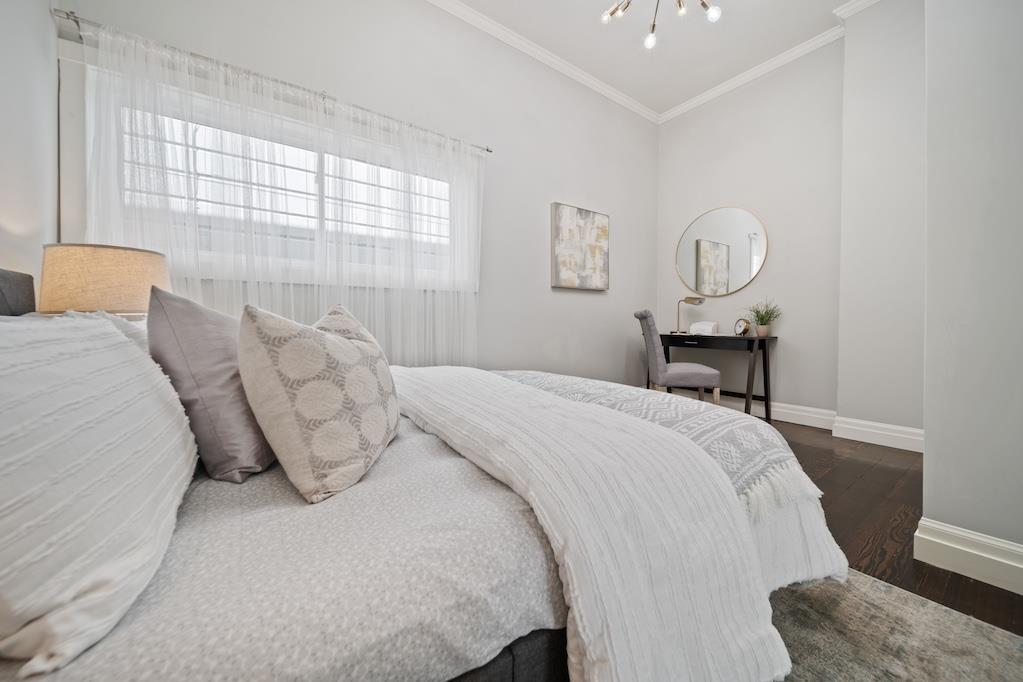 1731 11th Street Oakland, CA 94607 - Photo 12 of 35 a bedroom with bed and window