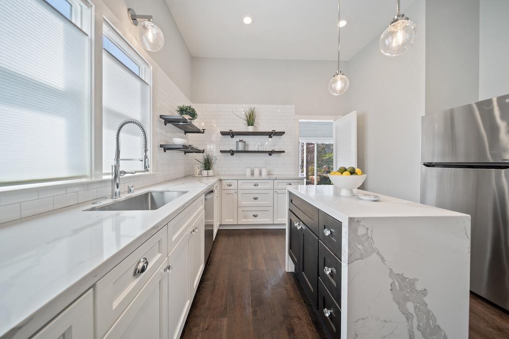 1731 11th Street Oakland, CA 94607 - Photo 16 of 35 a kitchen with a sink stove and cabinets