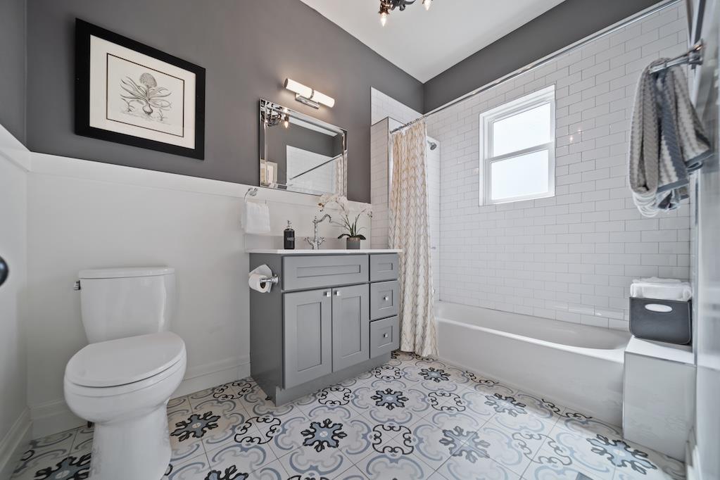 1731 11th Street Oakland, CA 94607 - Photo 18 of 35 a bathroom with a sink toilet and vanity