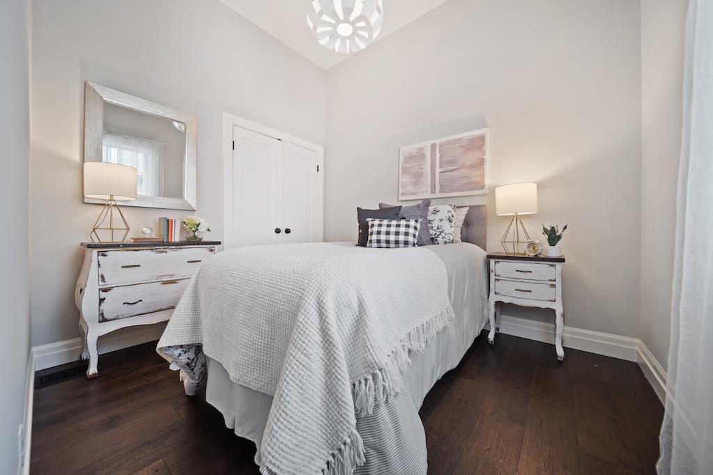 1731 11th Street Oakland, CA 94607 - Photo 20 of 35 a bedroom with a bed and a lamp on table