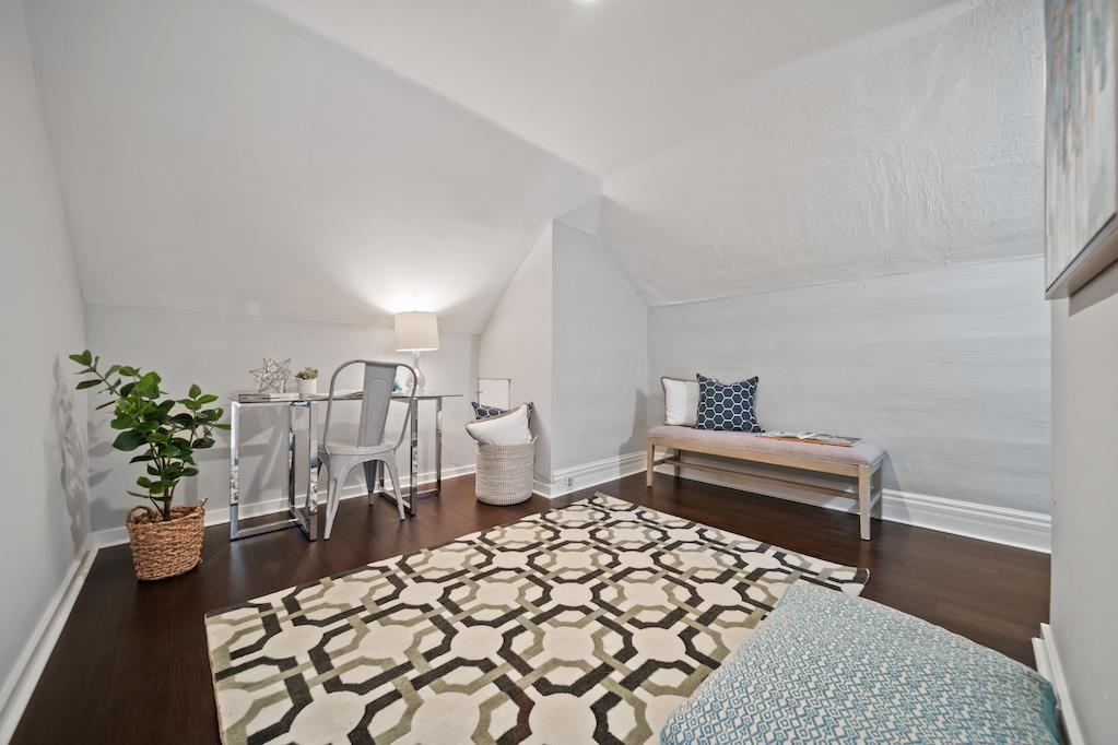 1731 11th Street Oakland, CA 94607 - Photo 21 of 35 a bedroom with a bed and a potted plant