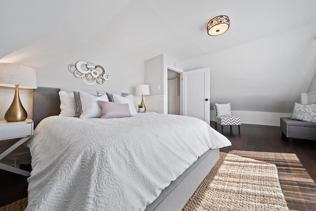 1731 11th Street Oakland, CA 94607 - Photo 26 of 35 a bedroom with bed and a table