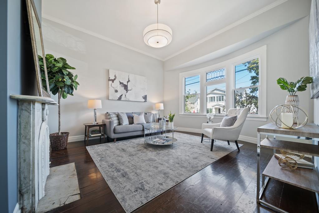 1731 11th Street Oakland, CA 94607 - Photo 5 of 35 a living room with furniture and a large window