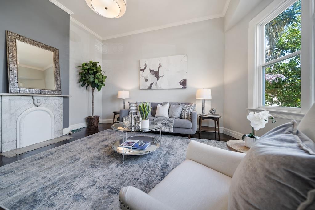 1731 11th Street Oakland, CA 94607 - Photo 8 of 35 a living room with furniture and a large window