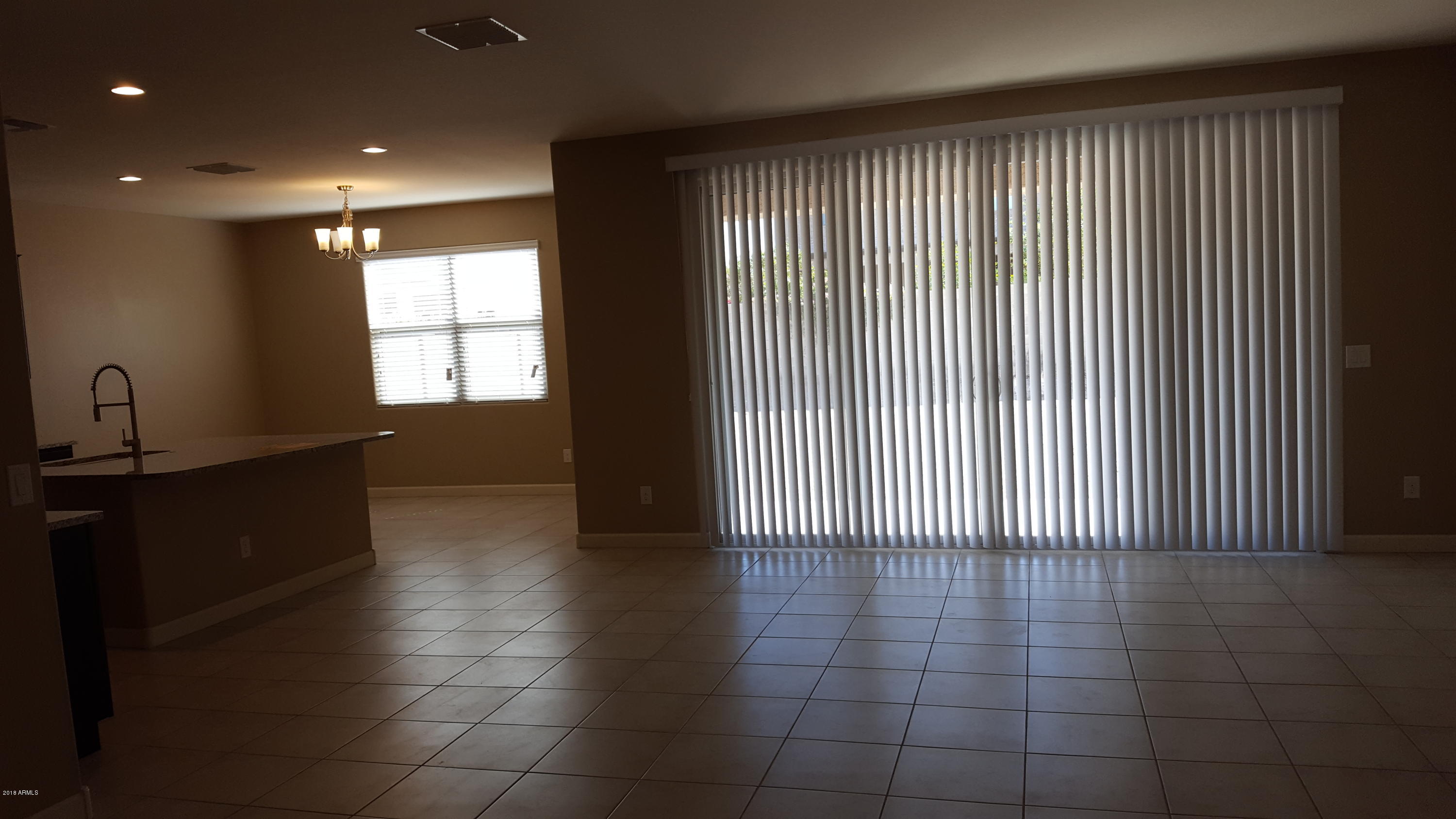 30611 West Osborn Road Buckeye, AZ 85396 - Photo 3 of 7 Taratesso Opal Great Room, Kitchen and d