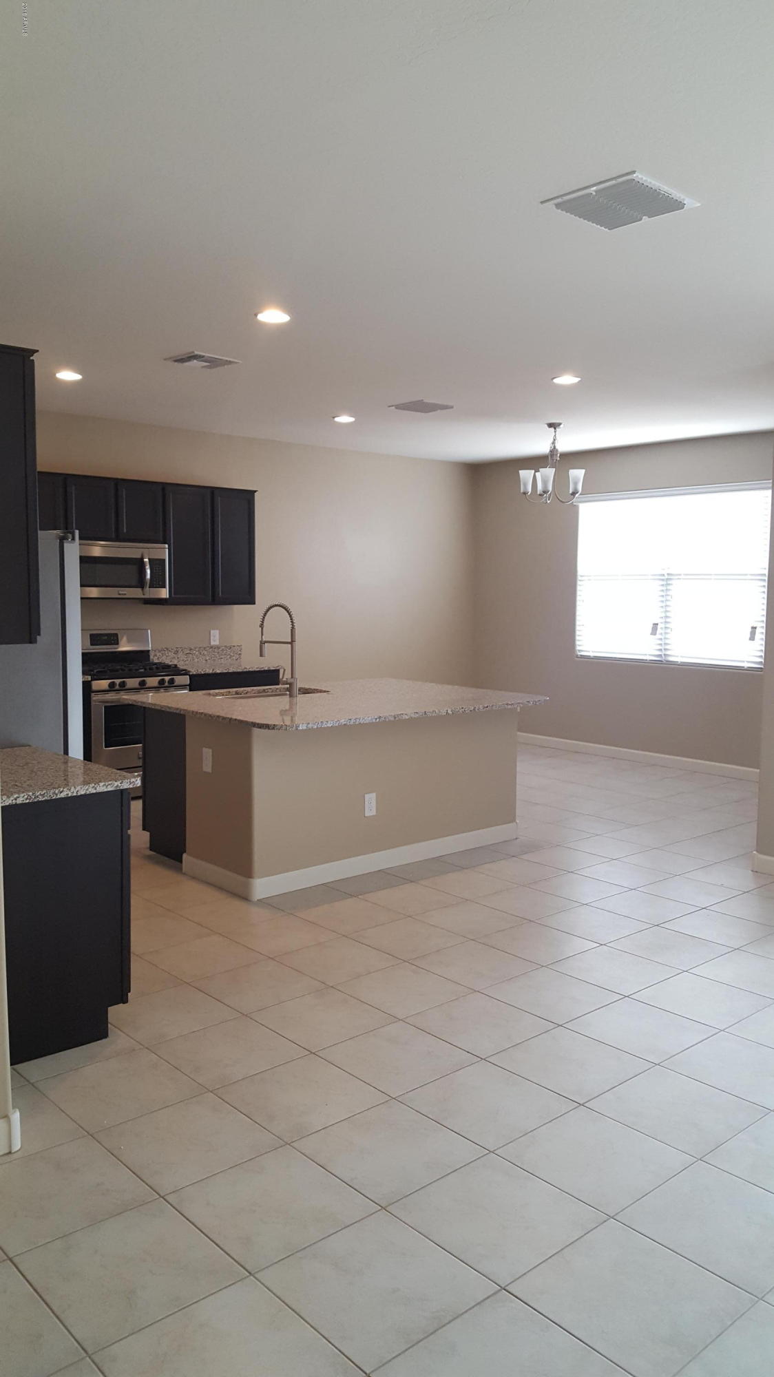 30611 West Osborn Road Buckeye, AZ 85396 - Photo 4 of 7 Opal Kitchen Dining area