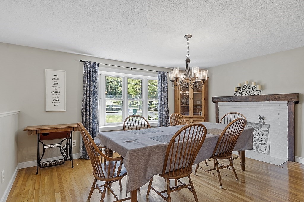 131 Andover Road Billerica, MA 01821 - Photo 3 of 16 a view of a dining room with furniture window and wooden floor