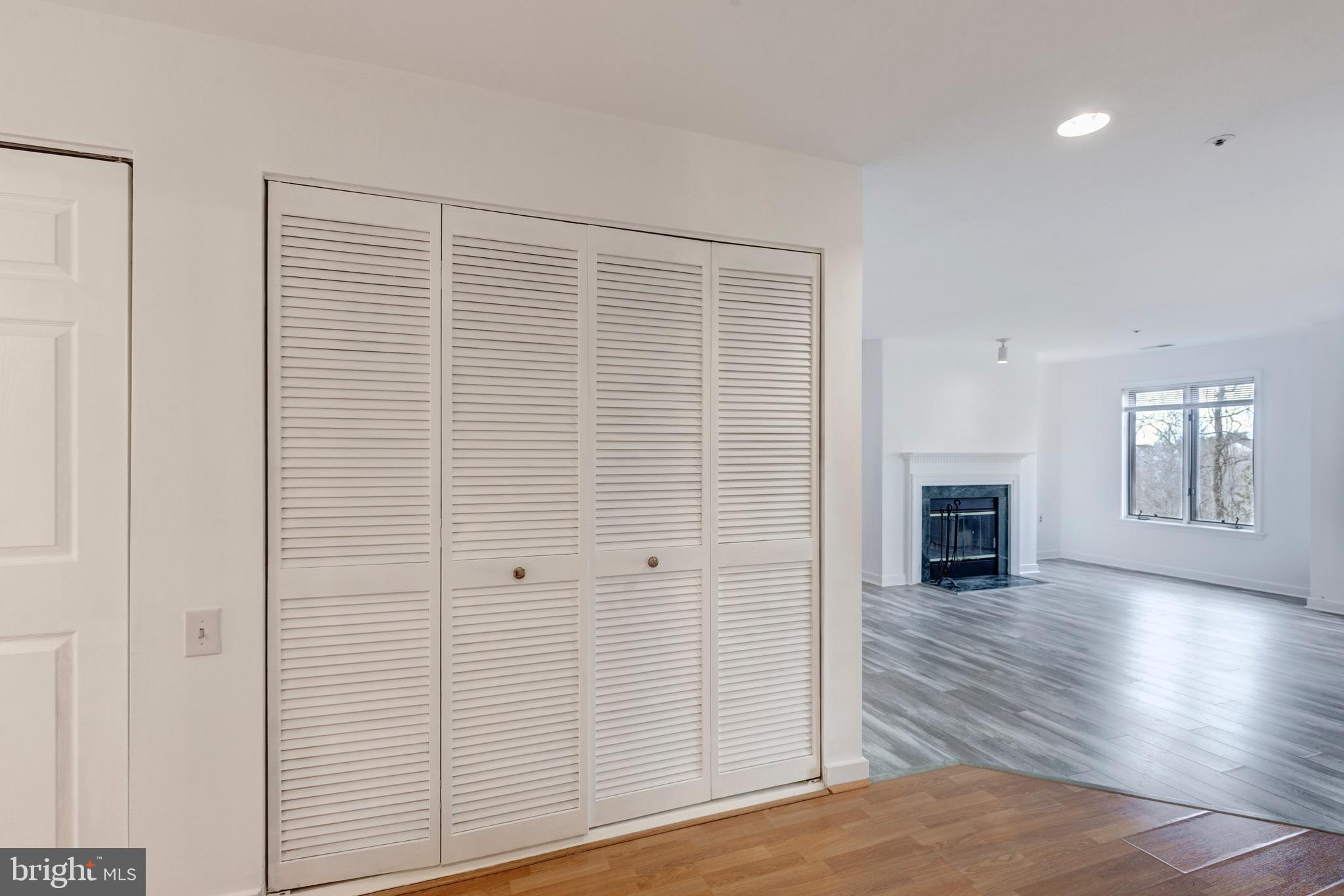 385 Pleasanton Road, Unit B22 Westminster, MD 21157 - Photo 6 of 35 a view of empty room with wooden floor and fireplace