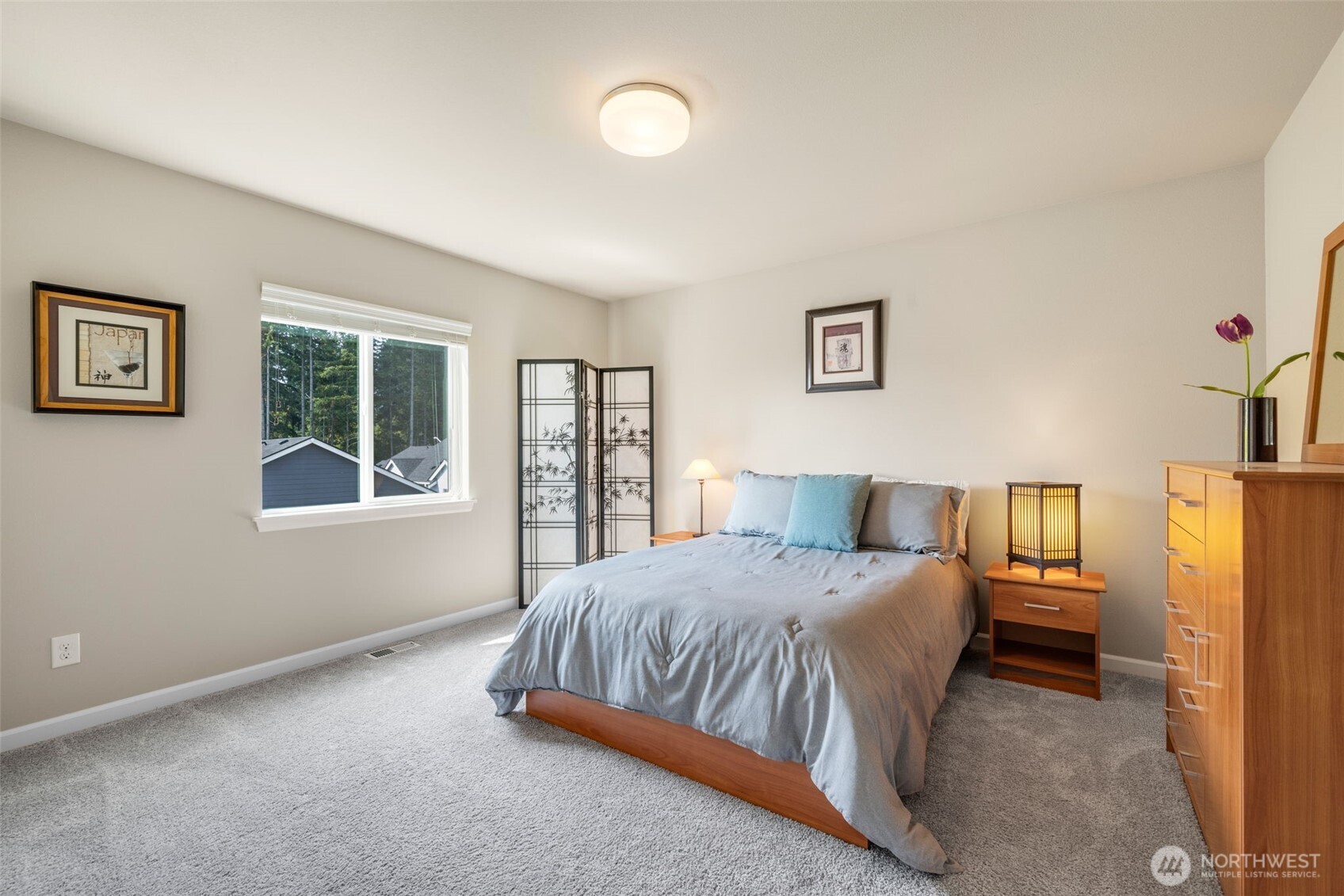 216 178th Street Southeast Bothell, WA 98012 - Photo 31 of 40 a bedroom with a bed dresser and a window