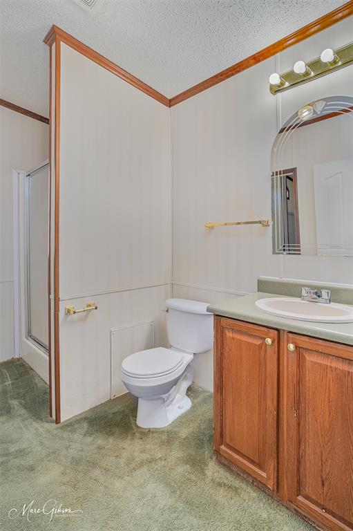 174 Bethel Road Frierson, LA 71027 - Photo 15 of 23 a bathroom with a sink mirror vanity and toilet