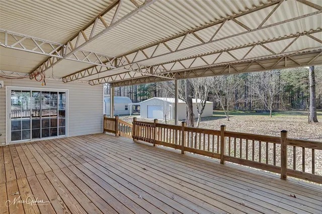 a bedroom with furniture and wooden floor
