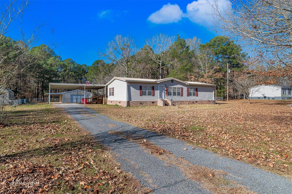 174 Bethel Road Frierson, LA 71027 - Photo 2 of 23 a front view of a house with a yard