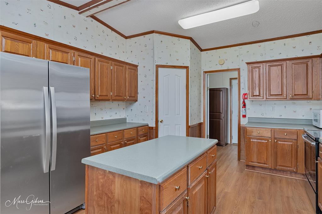 174 Bethel Road Frierson, LA 71027 - Photo 5 of 23 a kitchen with stainless steel appliances granite countertop a refrigerator a sink and dishwasher