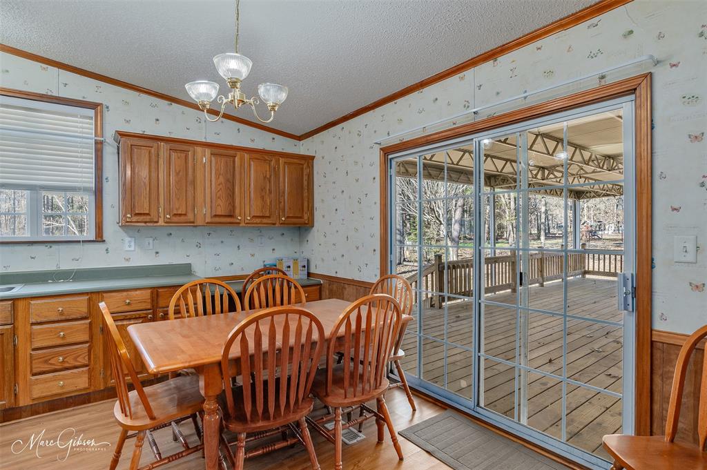 174 Bethel Road Frierson, LA 71027 - Photo 7 of 23 a view of a dining room with furniture window and wooden floor