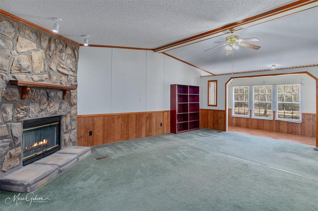 174 Bethel Road Frierson, LA 71027 - Photo 8 of 23 a view of an empty room with furniture and a fireplace