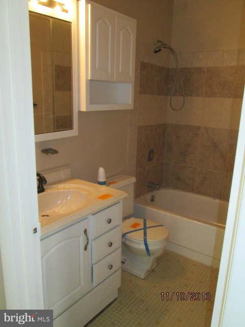 81 Haverhill Road Joppa, MD 21085 - Photo 7 of 18 a bathroom with a sink a toilet and bathtub